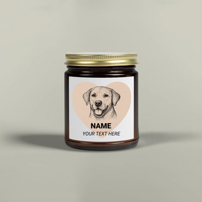 Amber glass scented candle jar with gold lid featuring a dog illustration label, made from coconut apricot wax with cotton wick.
